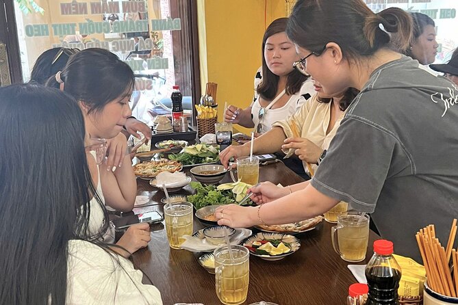 Da Nang Scooter Food Tour & Hidden Gems w/ Locals - Wrapping Nem Nướng on Lê Duẩn