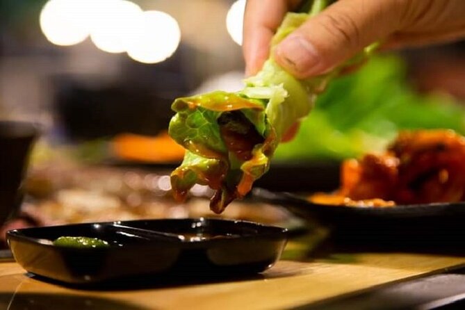 DaNang Night Foodie Tour-Sighseeing with Aodai Lady Rider Private - Dragon Bridge and the Han River after dark