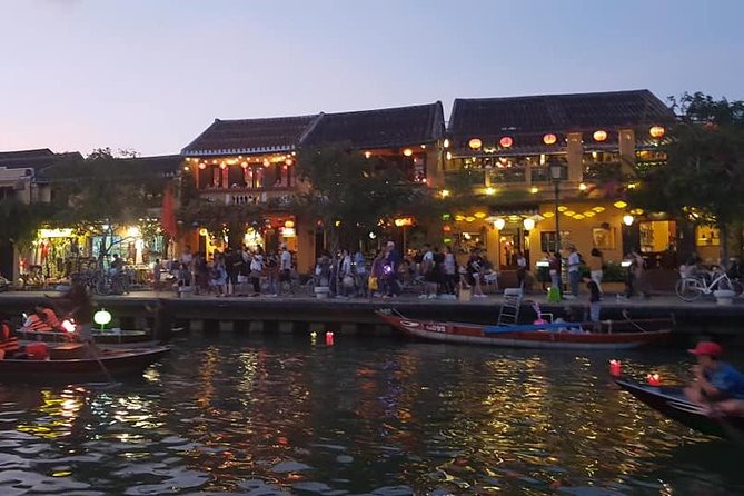 Hoi An Nightlife Tour with Hoi An Ancient Walking Tour, Boat Ride, Night Market - Lighting a lantern for good luck